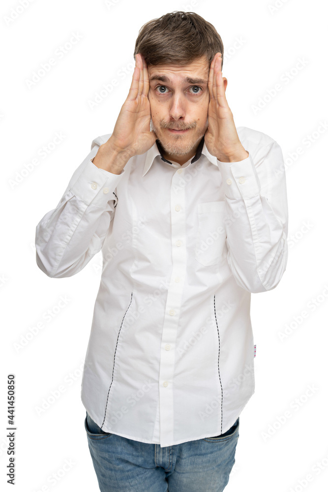 Young handsome tall slim white man with brown hair holding his head in white shirt isolated on white background Young handsome tall slim white man with brown hair holding his head in white shirt isolated on white background