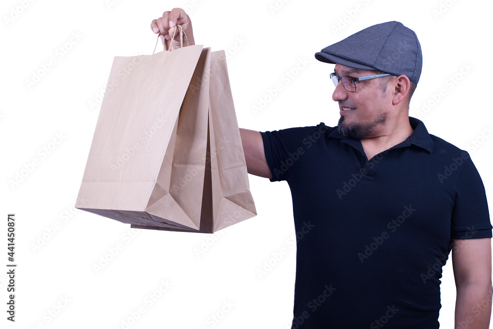 Sitting in studio of man grimacing and holding objects, on a white background. Sitting in studio of man grimacing and holding objects, on a white background.