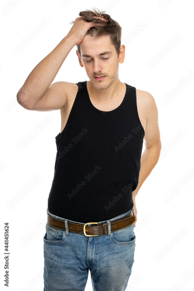 Young handsome tall slim white man with brown hair with his hand running through his hair in black undershirt isolated on white background Young handsome tall slim white man with brown hair with his hand running through his hair in black undershirt isolated on white background