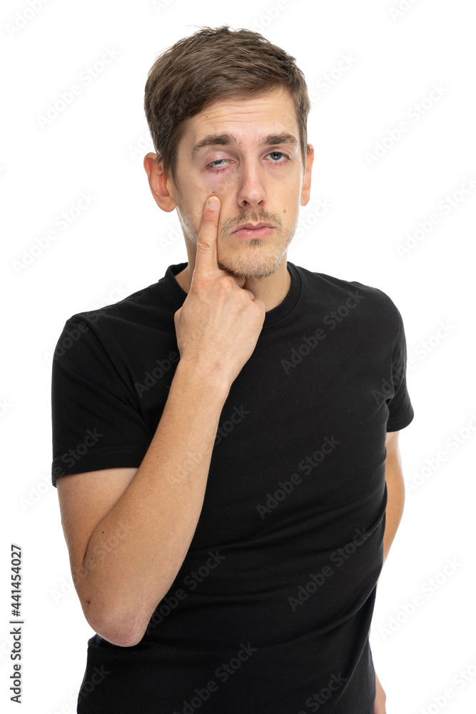 Young handsome tall slim white man with brown hair making creepy face in black shirt isolated on white background Young handsome tall slim white man with brown hair making creepy face in black shirt isolated on white background