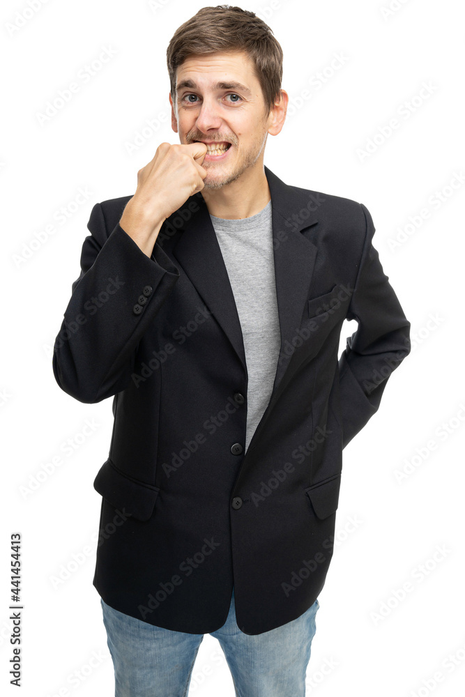 Young handsome tall slim white man with brown hair looks anxious in black blazer in blue jeans isolated on white background Young handsome tall slim white man with brown hair looks anxious in black blazer in blue jeans isolated on white background