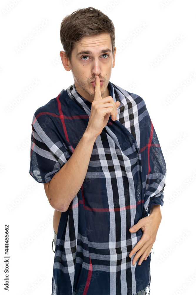Young handsome tall slim white man with brown hair shushing with scarf over his body in blue jeans isolated on white background Young handsome tall slim white man with brown hair shushing with scarf over his body in blue jeans isolated on white background