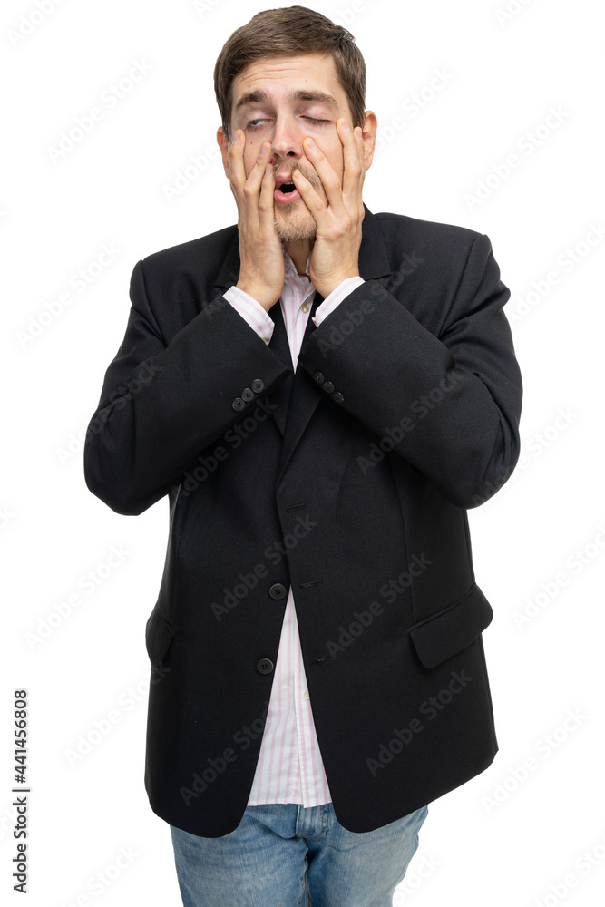 Young handsome tall slim white man with brown hair pulling his face in black blazer isolated on white background Young handsome tall slim white man with brown hair pulling his face in black blazer isolated on white background