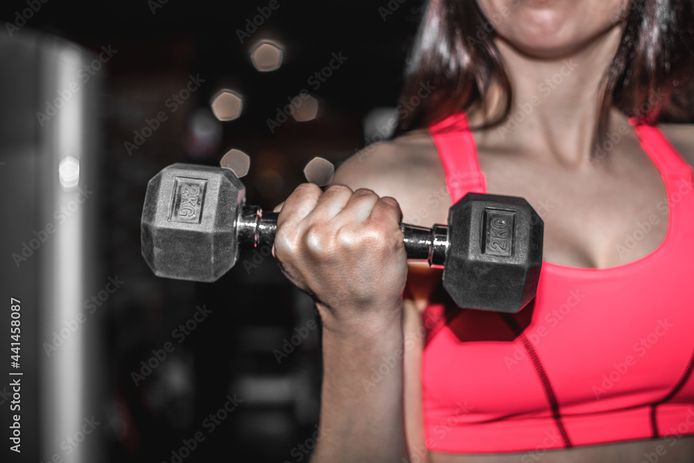 Sport and recreation concept. Sporty woman hands with dumbbells. Sport and recreation concept. Sporty woman hands with dumbbells.