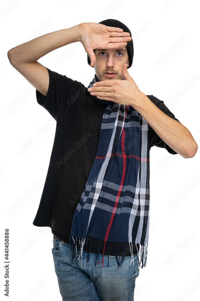 Young handsome tall slim white man with brown hair makes frame in front of his face with his hands isolated on white background Young handsome tall slim white man with brown hair makes frame in front of his face with his hands isolated on white background