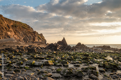 Rocks on Blackpool beach near Hartland Quay in North Devon. AONB. photo