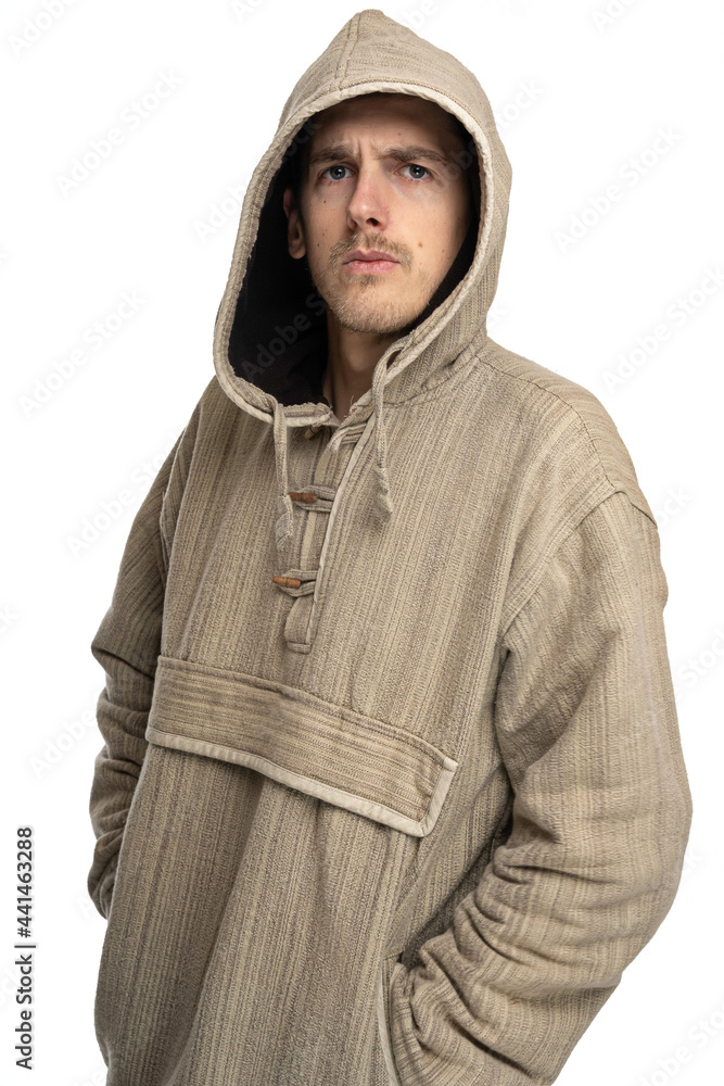 Young handsome tall slim white man with brown hair with hood on looking angry in natural style sweater isolated on white background Young handsome tall slim white man with brown hair with hood on looking angry in natural style sweater isolated on white background