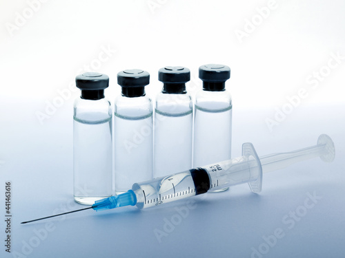 Close-up medical syringe and vials with medicine for injection