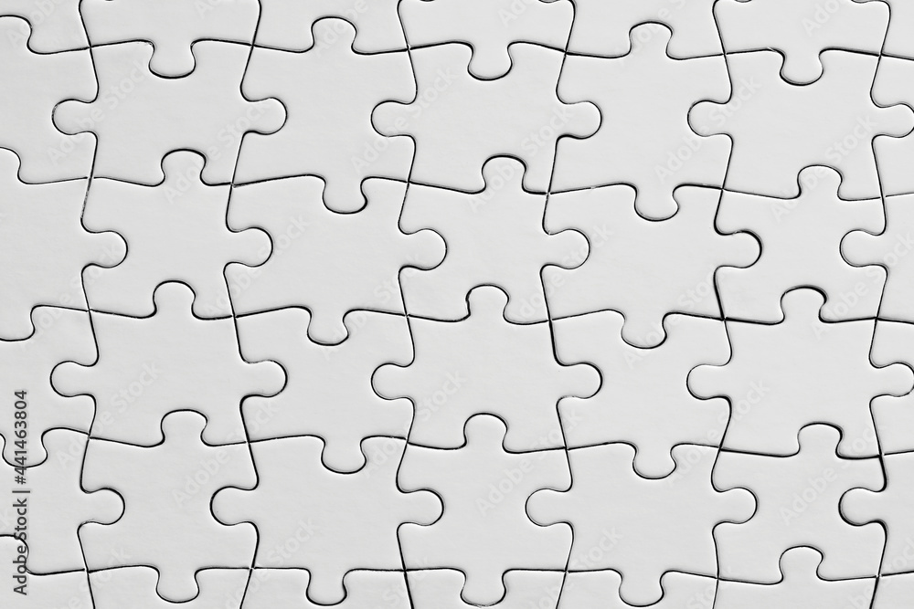 White jigsaw puzzle background. Overhead view with copy space. White jigsaw puzzle background. Overhead view with copy space.