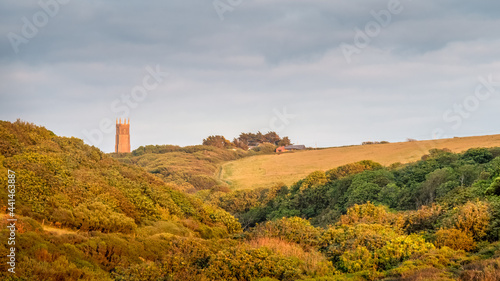 View of the landscape behind Blackpool Beach near Hartland, North Devon. AONB with Stoke village church tower visible in distance.