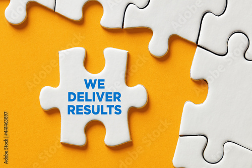 Photography We deliver results message on a puzzle piece