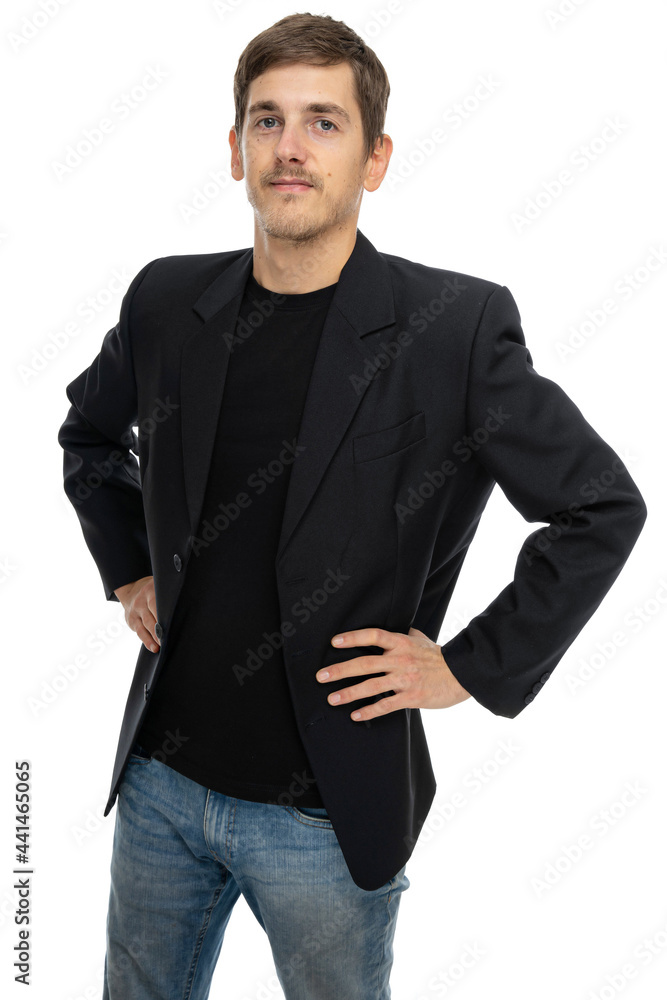 Young handsome tall slim white man with brown hair looking confident with hands on hips in black blazer isolated on white background Young handsome tall slim white man with brown hair looking confident with hands on hips in black blazer isolated on white background