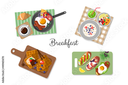 Breakfast set. concept of morning food. Scrambled eggs with bacon, cereals and fruit, Belgian waffles, toast and bruschetta