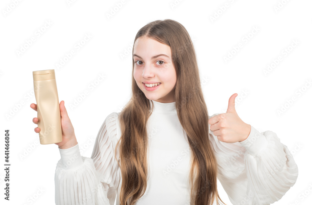 happy child presenting product of shampoo hair conditioner or shower gel show thumb up, lotion. happy child presenting product of shampoo hair conditioner or shower gel show thumb up, lotion.