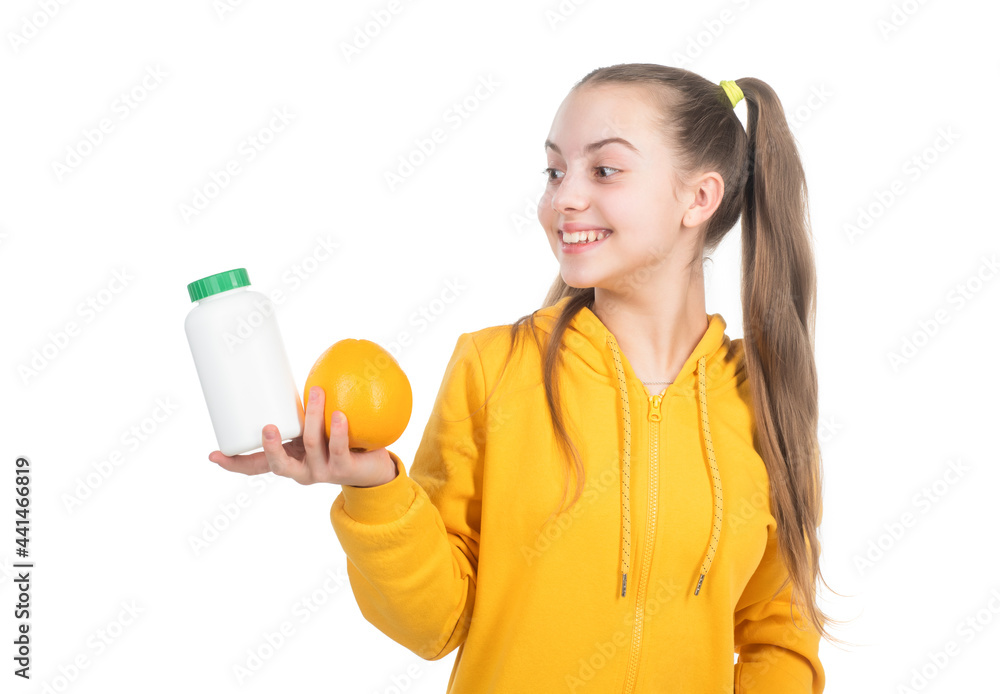 happy child choose between orange fruit and vitamin pill isolated on white, effervescent tablet. happy child choose between orange fruit and vitamin pill isolated on white, effervescent tablet.