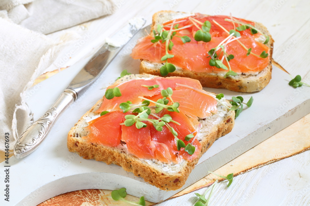 Bruschetta with salmon and cream cheese on a white plate Bruschetta with salmon and cream cheese on a white plate