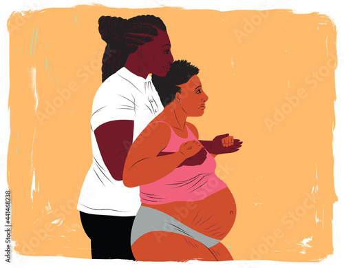 Doula supporting a mother from behind during childbirth labor