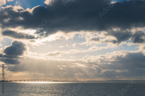 Bridge of R   island and sunset over the sea