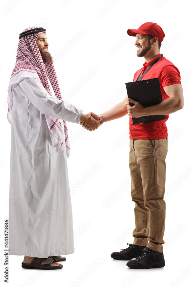 Full length profile shot of a delivery man shaking hands with a saudi arab man Full length profile shot of a delivery man shaking hands with a saudi arab man