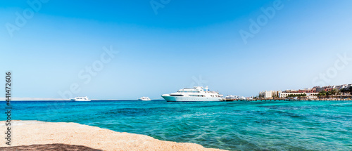 panorama view of ships in the Red Sea and a hotel on the shore in Egypt