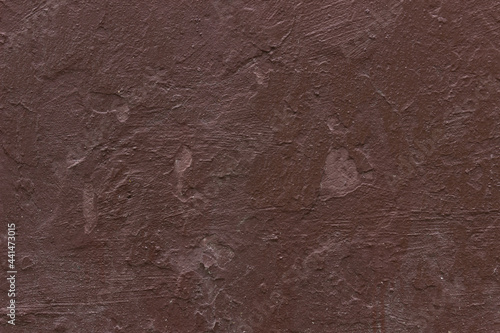 Old dark red ugly scratched concrete wall texture.