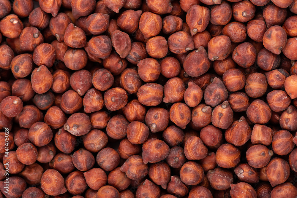 Brown chickpeas background. Red chickpea bean. Garbanzo, bengal gram or chick pea bean. Brown chickpeas background. Red chickpea bean. Garbanzo, bengal gram or chick pea bean.