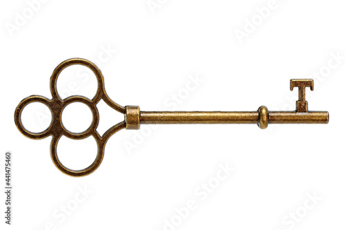 A single old brass key against a white background photo