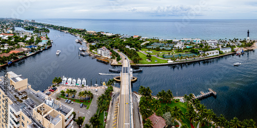 aerial drone shot of Hillsboro Inlet, Florida with bridge in city photo