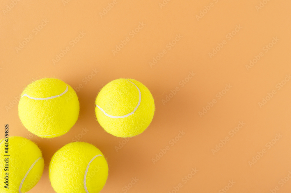 Tennis balls spontaneously arranged in a corner with a large copy space. Sports competition in tennis concept Tennis balls spontaneously arranged in a corner with a large copy space. Sports competition in tennis concept