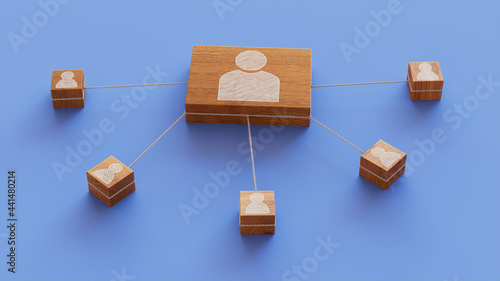 Social Technology Concept with user Symbol on a Wooden Block. User Network Connections are Represented with White string. Blue background. 3D Render. photo