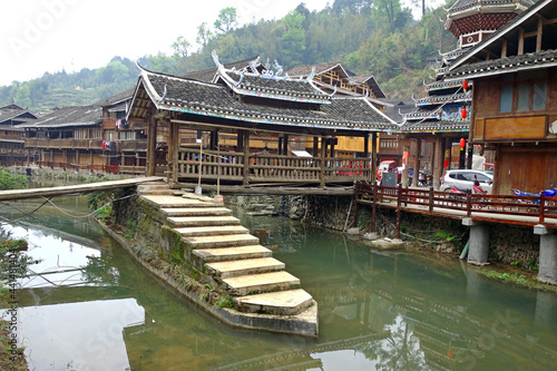 Zhaoxing Dong Zai ancient town (Zhao Xing Village) in the morning mist, Guizhou province China. One of Famous ancient village in Southern of China. Selective and soft focus.