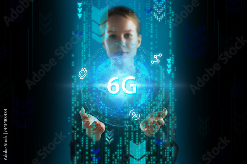 Business, Technology, Internet and network concept. Young businessman working on a virtual screen of the future and sees the inscription: 6G © Egor