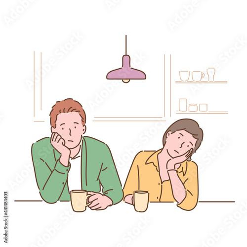 A couple sits at the table and shrugs their chins with a bored expression. hand drawn style vector design illustrations. 