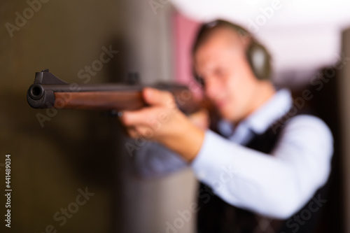 Man shoots semi-automatic rifle at a shooting range