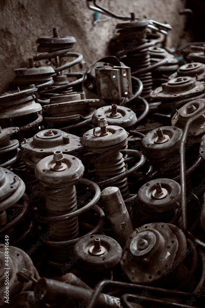 Car motor parts. Auto motor mechanic spare or automotive piece on dark background Car motor parts. Auto motor mechanic spare or automotive piece on dark background