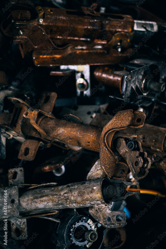 Car motor parts. Auto motor mechanic spare or automotive piece on dark background Car motor parts. Auto motor mechanic spare or automotive piece on dark background