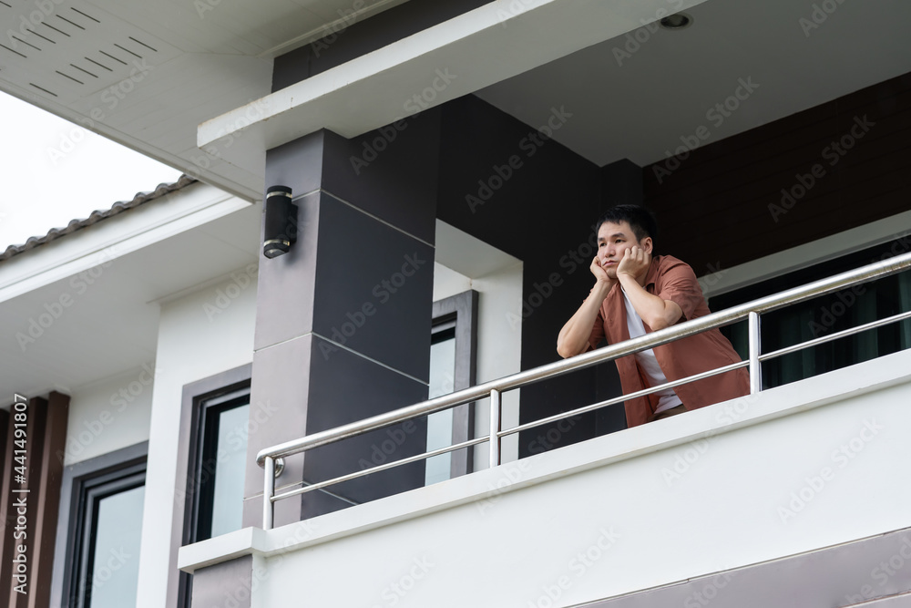 lonely man quarantine in balcony of home, coronavirus pandemic concept lonely man quarantine in balcony of home, coronavirus pandemic concept