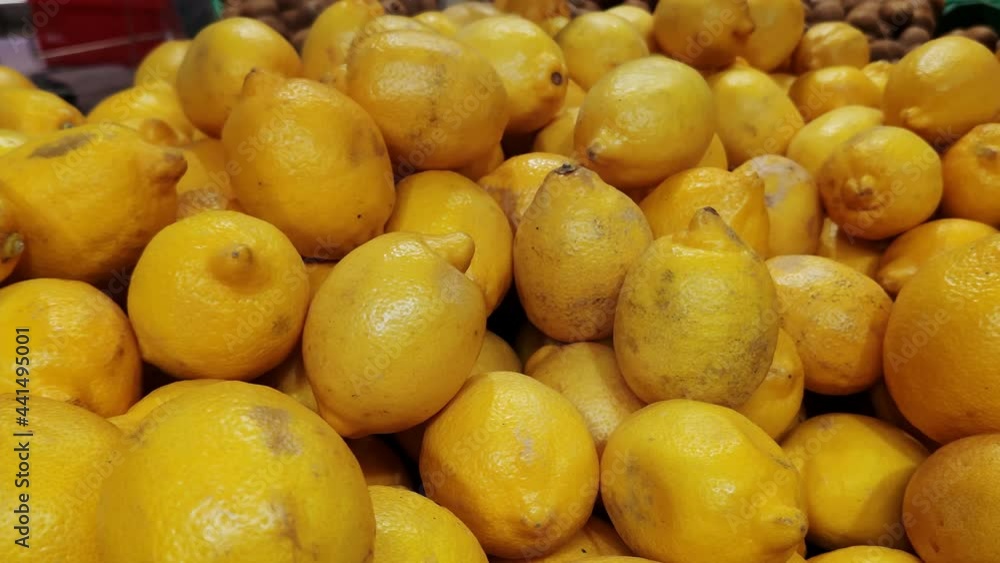 Stack of lemons in grocery store. Industry of selling products Stack of lemons in grocery store. Industry of selling products