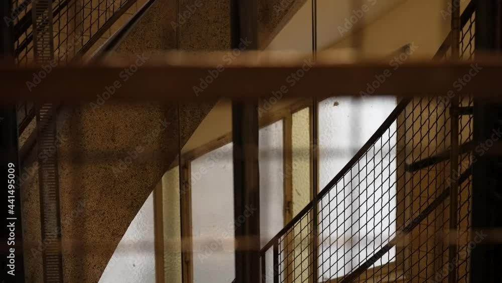 Watching through the steel metal grid of an empty ancient elevator - POV close up Watching through the steel metal grid of an empty ancient elevator - POV close up