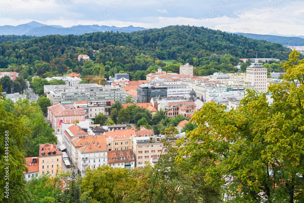 A partial panoramic view under a cloudy sky of central Ljubljana, Slovenia's capital, looking to the Tivoli City Park