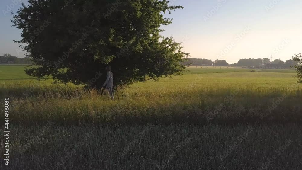 A man is walking on an old railway road. Drone shot from the side 4k A man is walking on an old railway road. Drone shot from the side 4k