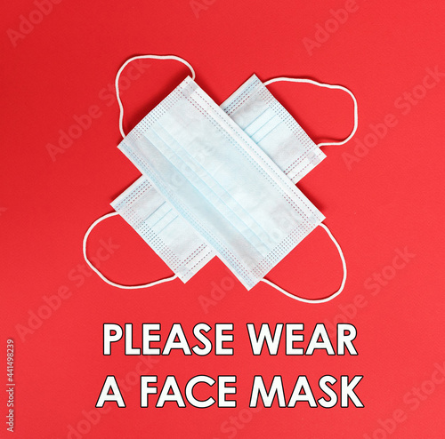 Safety sign : Please wear a Face mask, covid-19, corona virus - face mask with red background