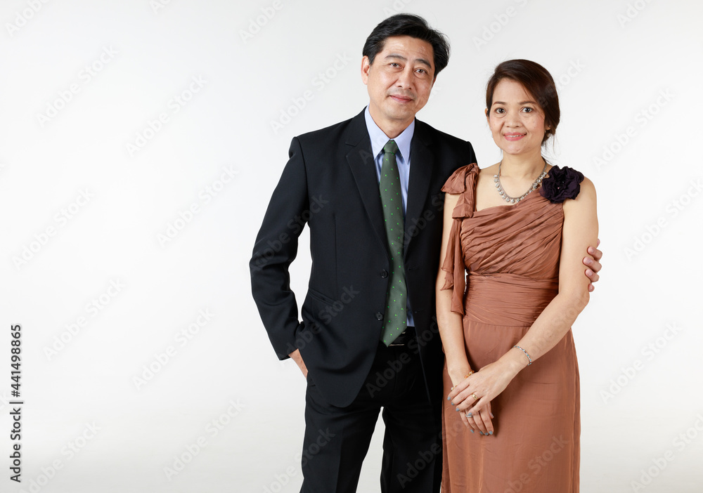 Senior man and woman couple lover taking photos together with pride and happy in long time love. Portrait on white background. Senior man and woman couple lover taking photos together with pride and happy in long time love. Portrait on white background.
