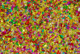 colorful, glossy glitter and confetti spread on white background for festive, greeting atmosphere. pattern design artwork for banner or decorations