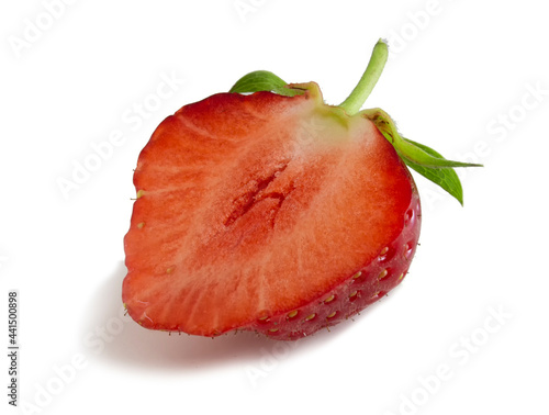 Red strawberry in cut isolated on white background. Full focus of half a ripe berry.