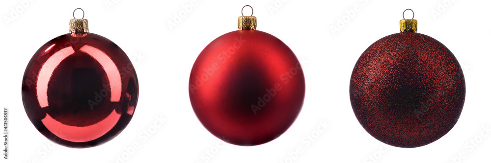 three different Christmas tree toys in red on a white isolated background. three different Christmas tree toys in red on a white isolated background.