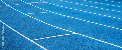 Blue running treadmill track with lane in-stadium outdoors.banner image.