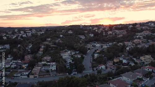 Spanish neighborhood in the mountains at sunset, aerial photo