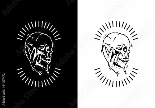 Black and white of hand and skull badge