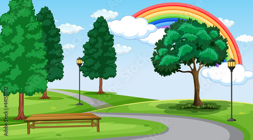 Park landscape scene with rainbow in the sky